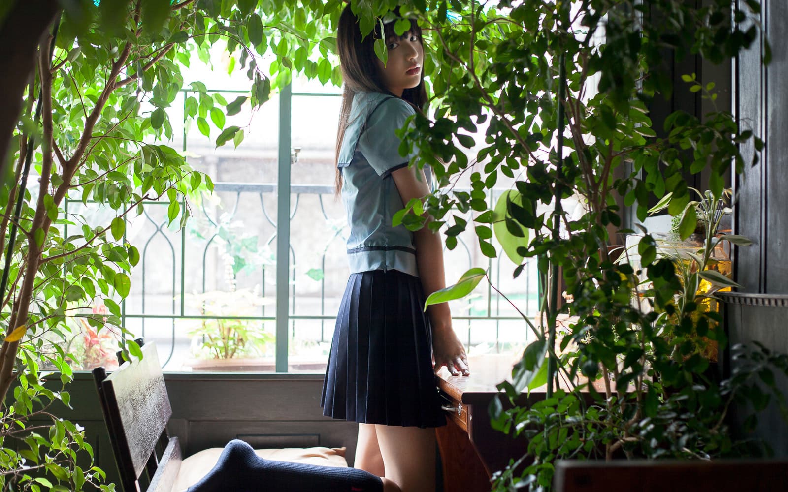 May afternoon close-up of nylon-clad toes peeking from cotton socks, soft skin and subtle sheen visible